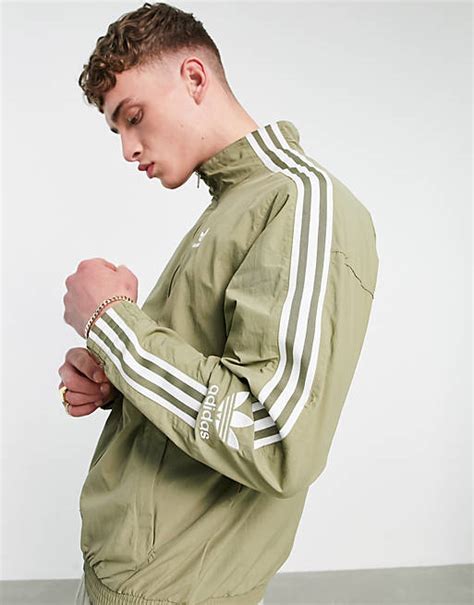 adidas Originals adicolor lock up track jacket in khaki .